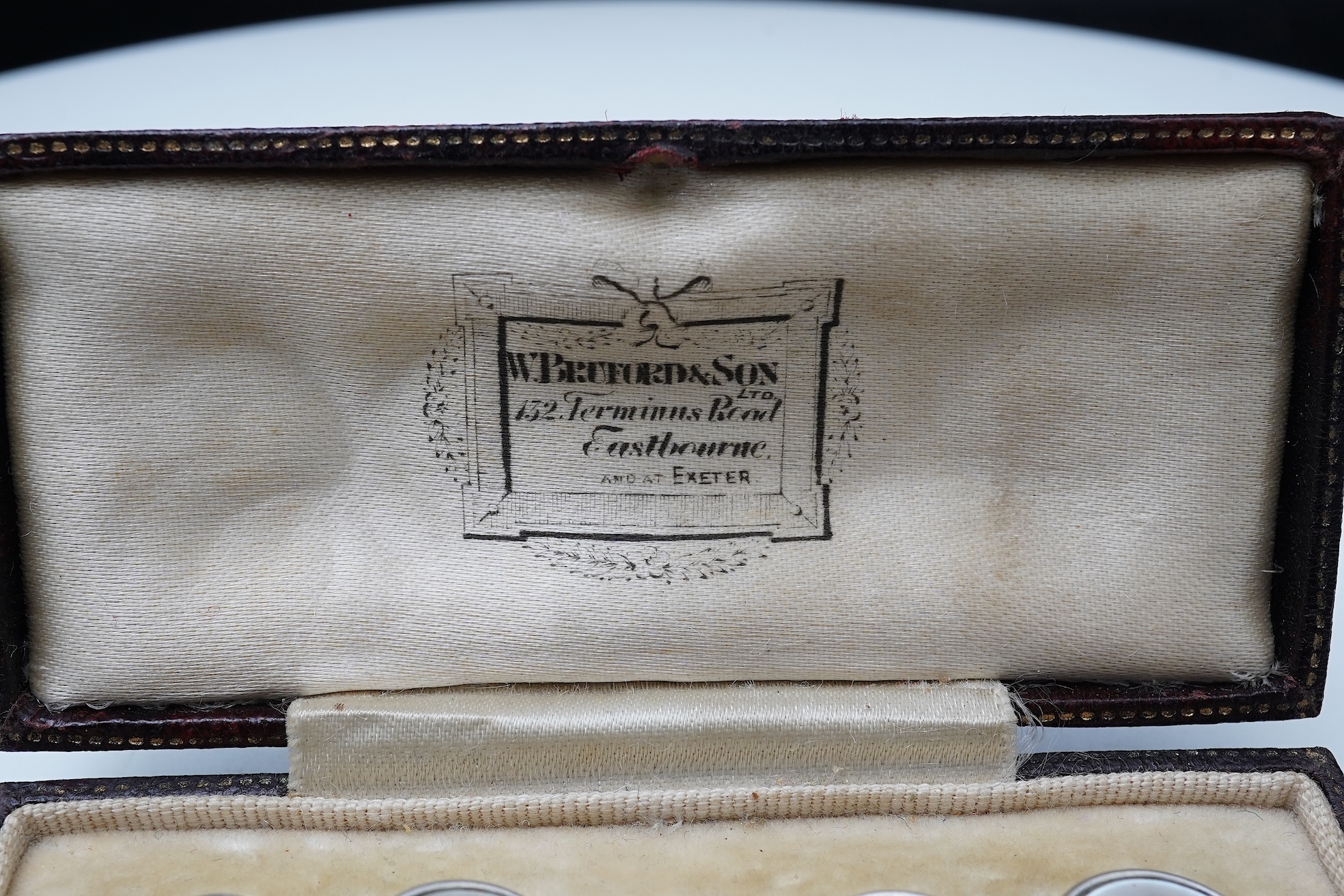 A pair of mother of pearl and sapphire cufflinks, early 20th century